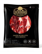 Jamón de bellota 100 % ibérico loncheado a cuchillo de Los Romeros de Alanís, envasado al vacío en sobre